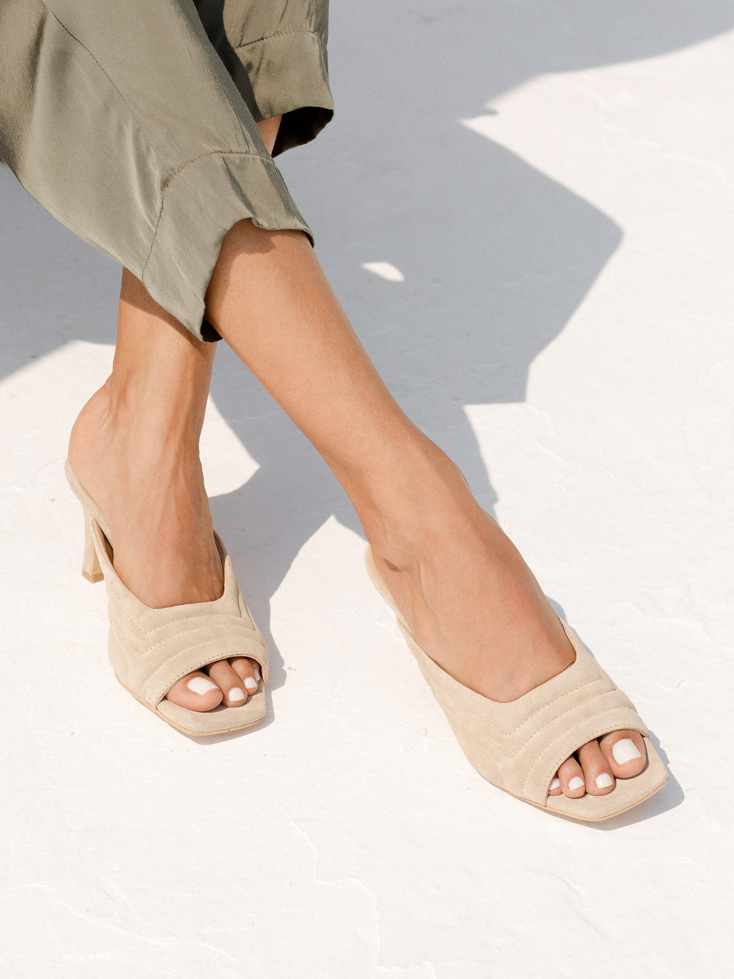 Leather quilted mules in sand suede