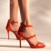 Heeled leather sandals in red