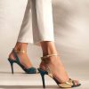 Heeled leather sandals in petrol and gold