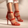Heeled leather sandals in red