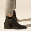Flat ankle leather boots in black
