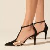 Heeled leather pumps in black suede