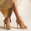 Heeled leather sandals in gold