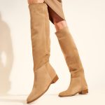 Flat leather boots in beige suede