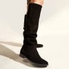 Flat leather boots in black suede